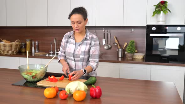 Woman is Standing Near the Bowl of Super Healthy Salad and Smiling