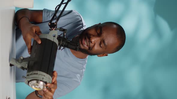 Vertical Video African American Vlogger Doing Product Review of Studio Light alt