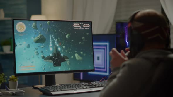 Winner Gamer Sitting on Gaming Chair Playing Space Shooter Video Games alt