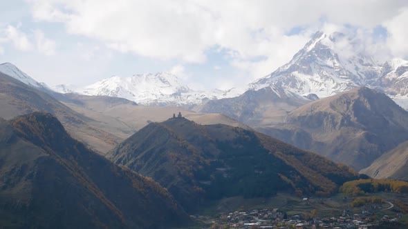 Mountain Kazbek Mkinvartsveri and Town Stepantsminda Autumn Colors of Georgia alt