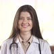 Portrait of a Smiling Young Female Doctor Satisfied with Her Work in the Hospital Corridor - VideoHive Item for Sale