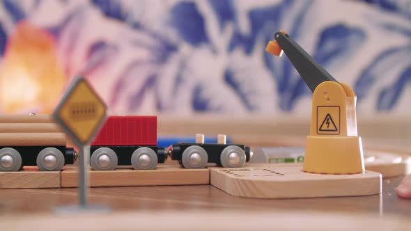 Toy Train Pulls Up To the Loading Station. alt