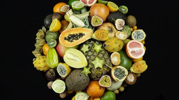 Shooting Exotic And Tropical Fruits On A Black Background Top View.