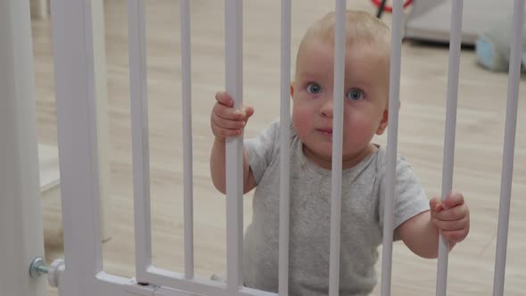 Childproofing House Doorway with Safety Baby Gates to Keep Curious Crawler Away From Dangerous Areas alt