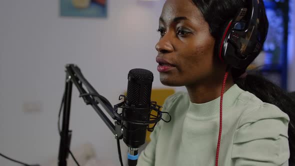 Black Vlogger on Air During Podcast Channel Using Mixer Checking Sound alt