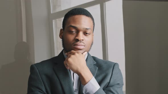 Close Up Young Pensive Serious African American Man Student Office Worker Concerned About Problem or alt