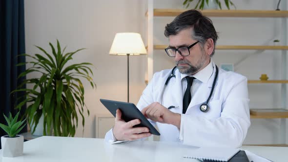 Senior Doctor 50s Works in Tablet alt