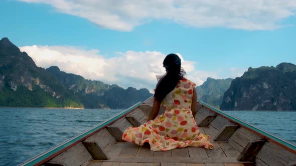 Khao Sok Thailand Woman on Vacation in Thailand Girl in Longtail Boat at the Khao Sok National Park alt
