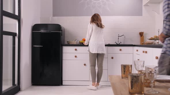 Happy Pregnant Woman Rejoicing Husband's Gift alt