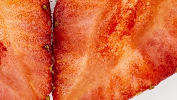 Time Lapse of Rotting Crushed Strawberries and the Development of Mold on a White Background alt
