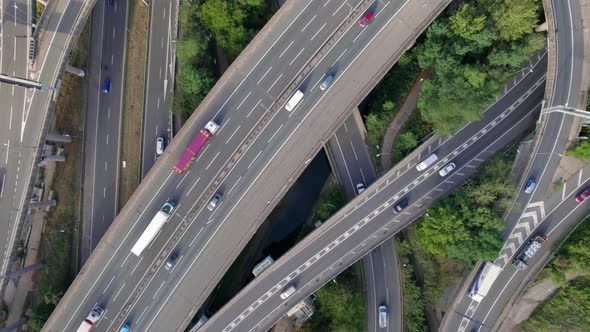 Vehicles Driving Navigating a Spaghetti Interchange Road System alt