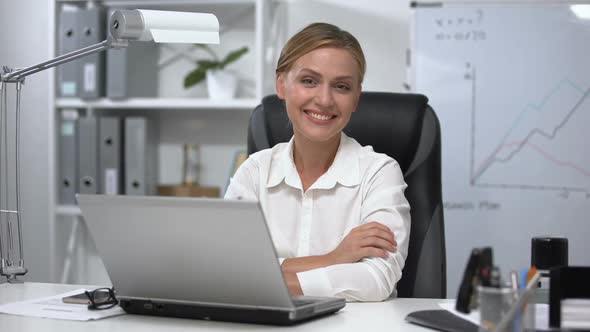 Attractive Business Lady Smiling to Camera Sitting in Office, Success, Leader