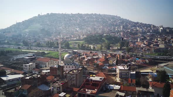 Drone view on poverty slum district and muslim mosque alt