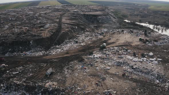 Aerial View on City Rubbish Dump with Flocks of Seagulls alt