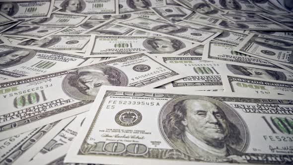 American One Hundred Dollar Paper Banknote Pile on Office Desk alt