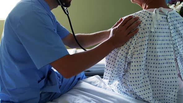 Nurse checking the patient with stethoscope alt