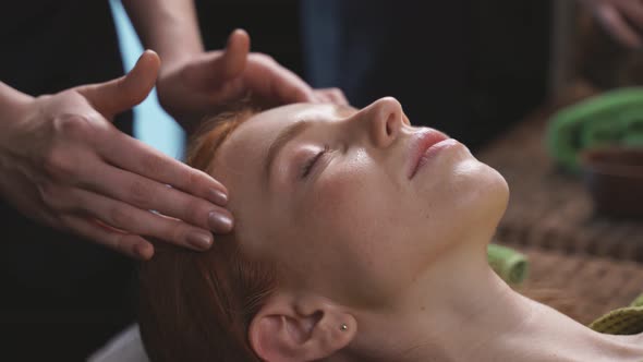 Closeup of a Woman Receiving Facial Massages and Spa Treatments at a Luxury Wellness Center