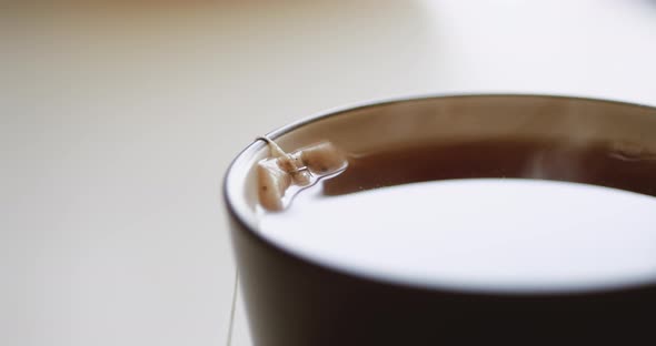 Tea Bag Is Brewed in a Mug