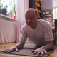 Senior man doing yoga pose or pilates at home. - PhotoDune Item for Sale
