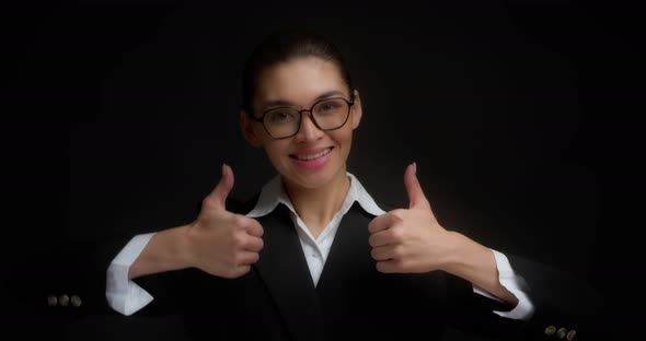 Positive Business Woman Smiles and Gives Two Thumbs Up