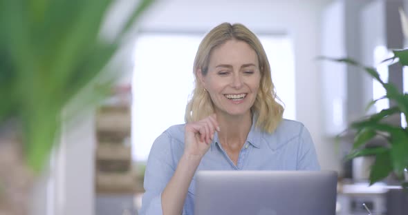 Businesswoman making video call on laptop