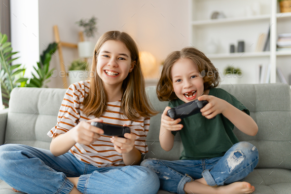 Children playing video games Stock Photo by choreograph | PhotoDune