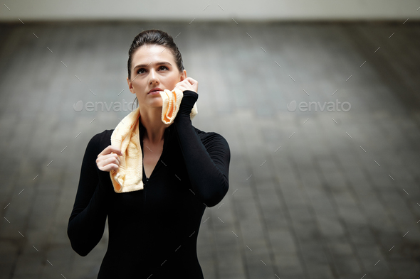 Sportswoman Wiping off Sweat