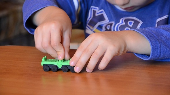 Child Playing With Toys 2