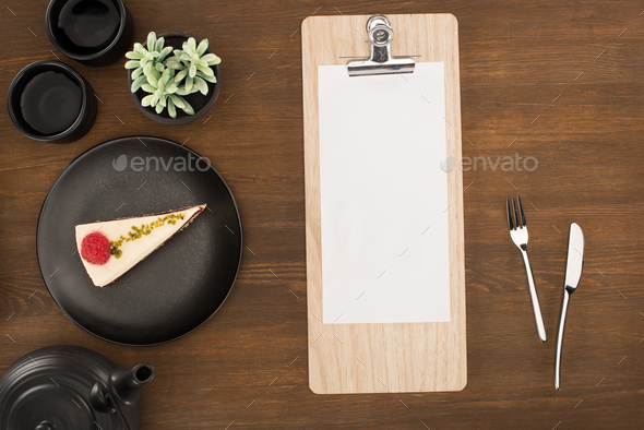view from above of blank white paper on wooden table Stock Photo by  LightFieldStudios