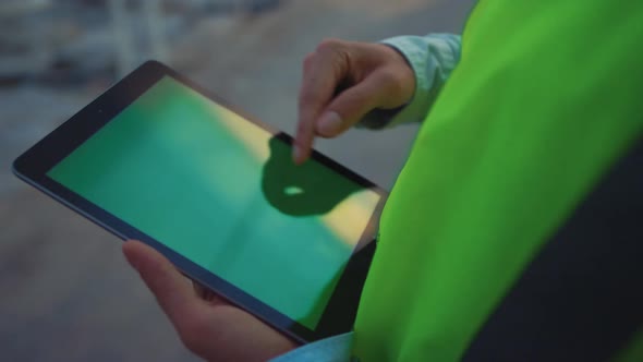 Factory Worker Holding Tablet Analyzing Important Production Data Closeup Hands alt