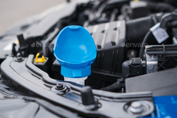 Blue cap of the reservoir for windshield washer fluid, close up