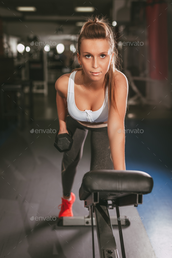 Girl Exercising At The Gym