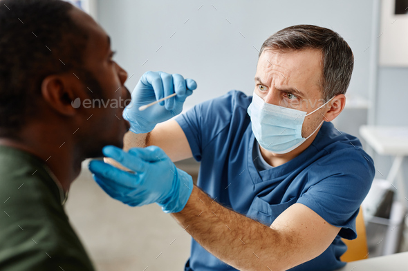 Doctor Taking Mouth Swab