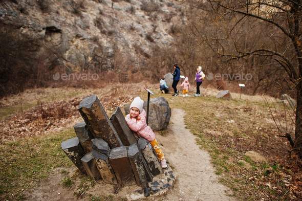 Family at Turold science trail, Mikulov, Czech Republic learn types of rock breeds.
