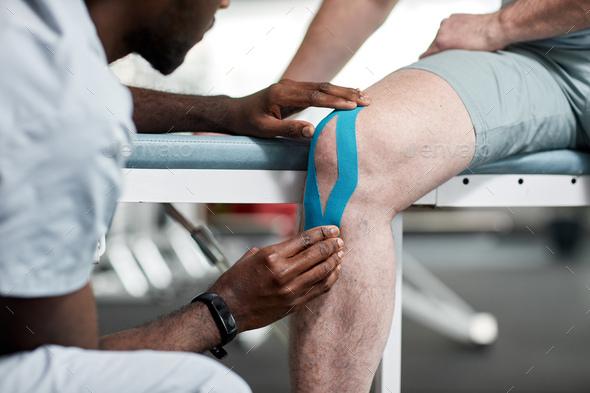 Therapist Taping Muscles