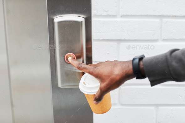 Black Man Pushing Lift Button