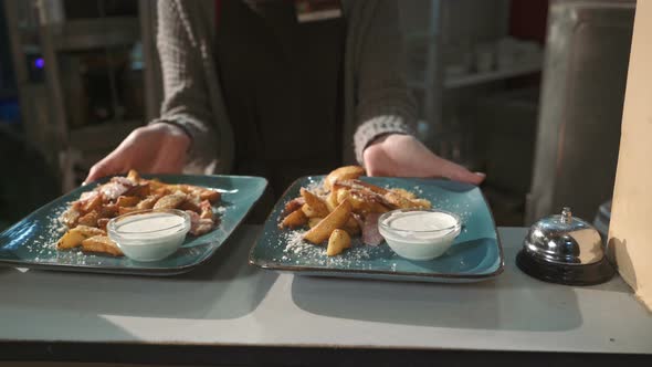 Waiter Serving Clients alt
