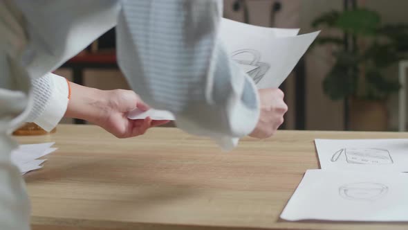 Close Up Of Asian Woman Designer Is Arranging The Layout Bond On The Table At The Office alt