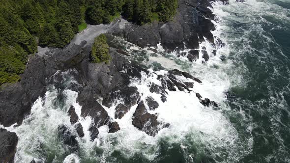 Zenith view of big waves crashing on rocky shore of botany bay from above. Aerial footage of beach o alt