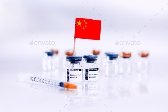 Coronavirus (COVID-19) vaccine vials with the flag of China.