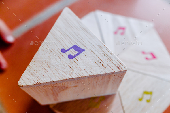 Wooden block with musical notes to learn children music theory. - Stock Photo - Images