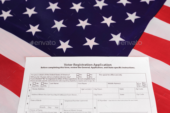 American citizens fill out the form to apply in the voting, on patriotic background