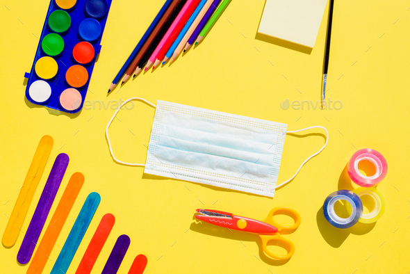 Creativity at school is developed with colorful materials and with the protection of a mask