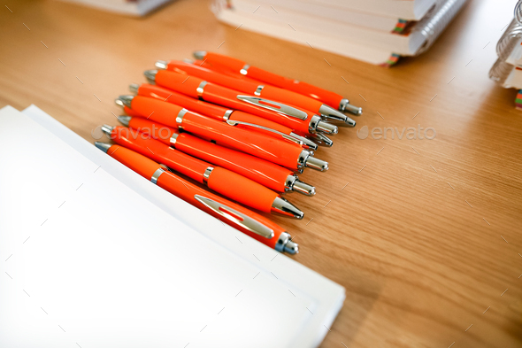 Pens and marketing advertising for business and company promotion, unfocused background