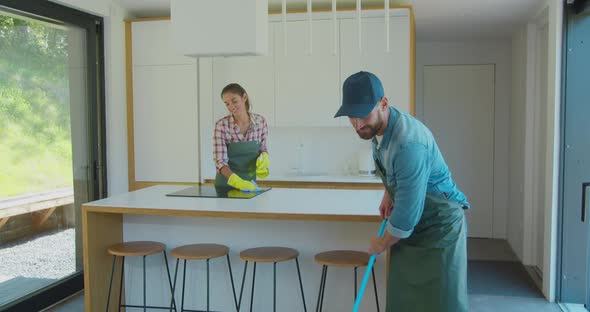 Cleaning Service Team at Work in Kitchen. alt