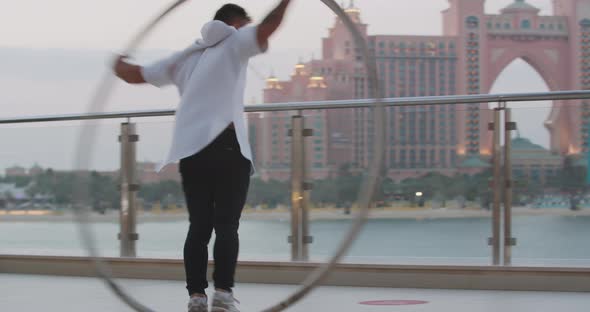 Atlantis Hotel in the Background of a Sportsman Doing Wheel Gymnastics alt