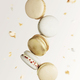 White, yellow, gold macaron cookies. Colorful and sweet small French macaroons - PhotoDune Item for Sale