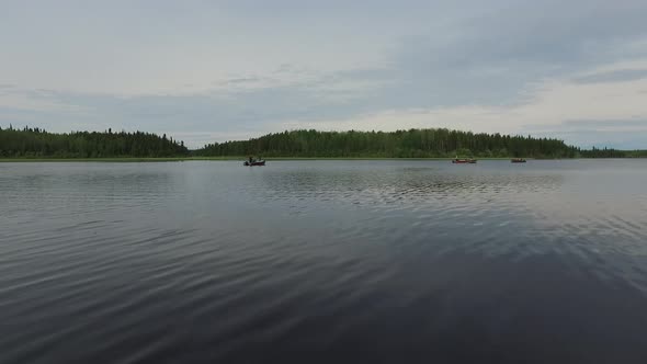 Boats floating on a lake alt