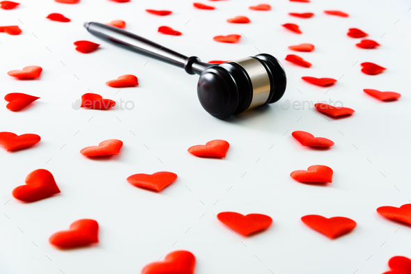 Gavel surrounded by red hearts isolated on white, love for justice and Judge law medical Pharmacy