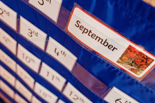 The month of September is the one of the return to the school, image of a school calendar of wall.